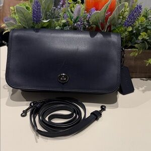 Coach Turnlock Crossbody bag in navy leather.